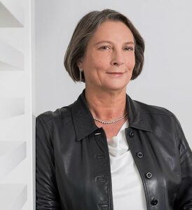 woman smiling in a leather jacket